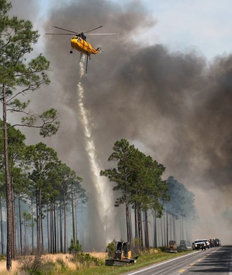 Helicopter supports firing operation on West Mims Fire West Mims Wildfire at Okefenokee NWR